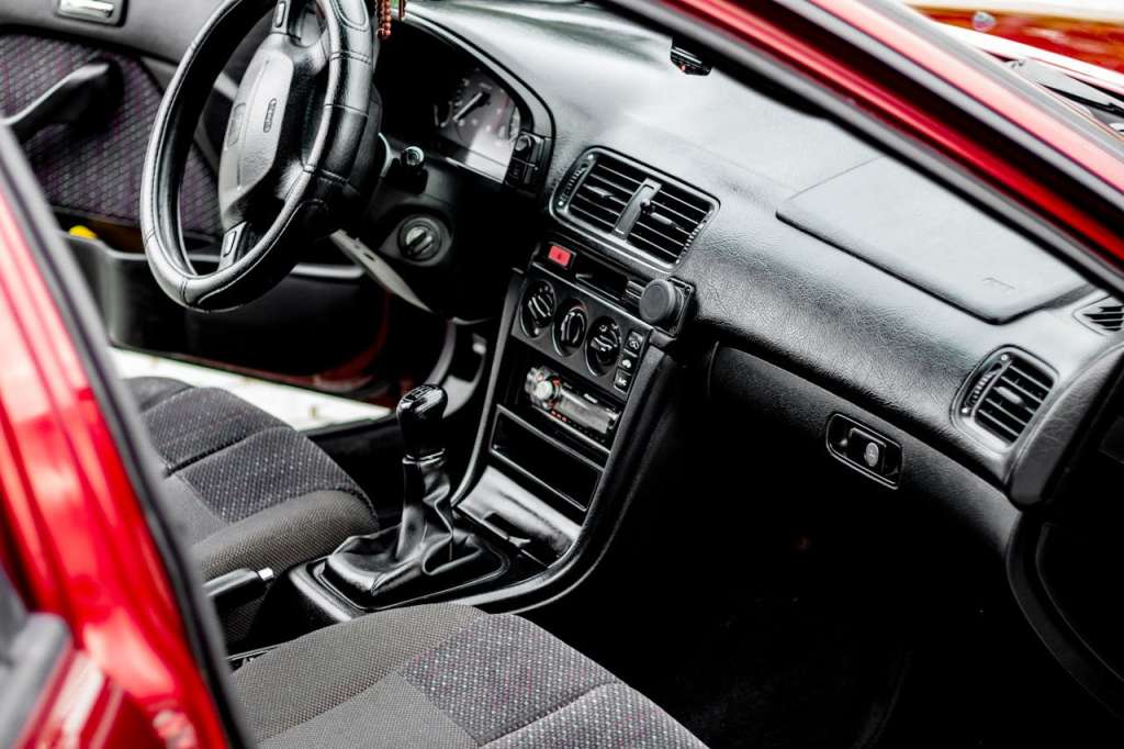 Photo by ??????? ???????: https://www.pexels.com/photo/close-up-shot-of-a-black-and-red-car-interior-6128304/