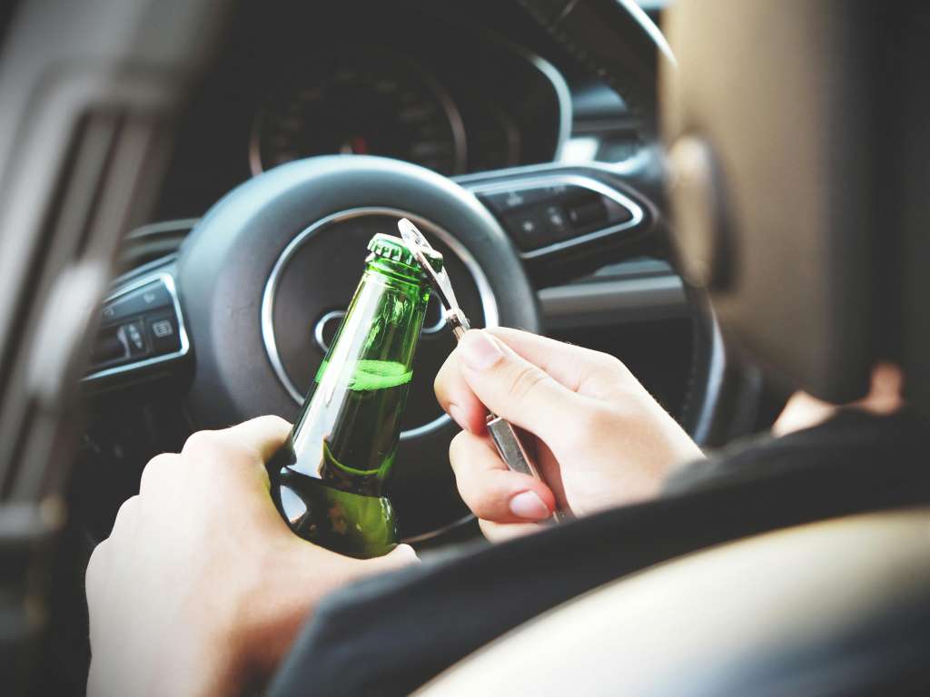 Photo by energepic.com: https://www.pexels.com/photo/person-opening-bottle-on-car-288476/